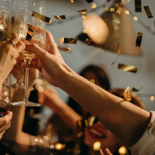 Guests raising a toast with confetti falling at a lively shag party – IDJ DJ services for memorable Thunder Bay shags.