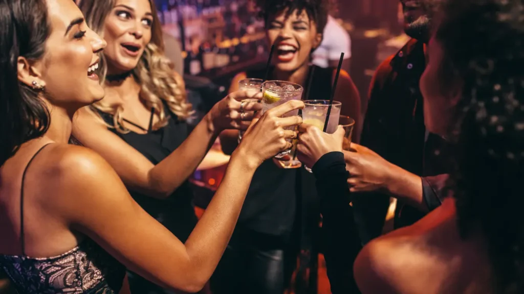 Group of friends toasting and celebrating at a lively party – IDJ’s shag DJ package in Thunder Bay.